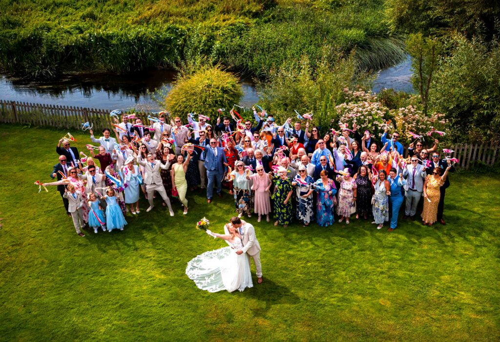 Group photo on wedding day colourful and fun