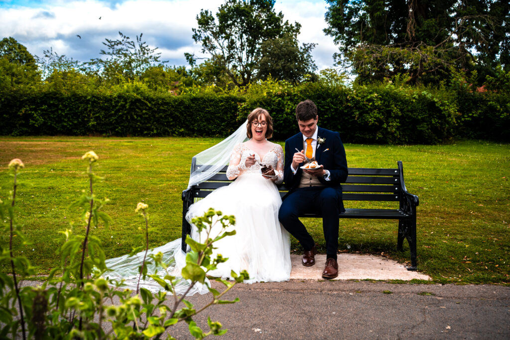 Wedding couple eating their wedding cake on their couples shoot
