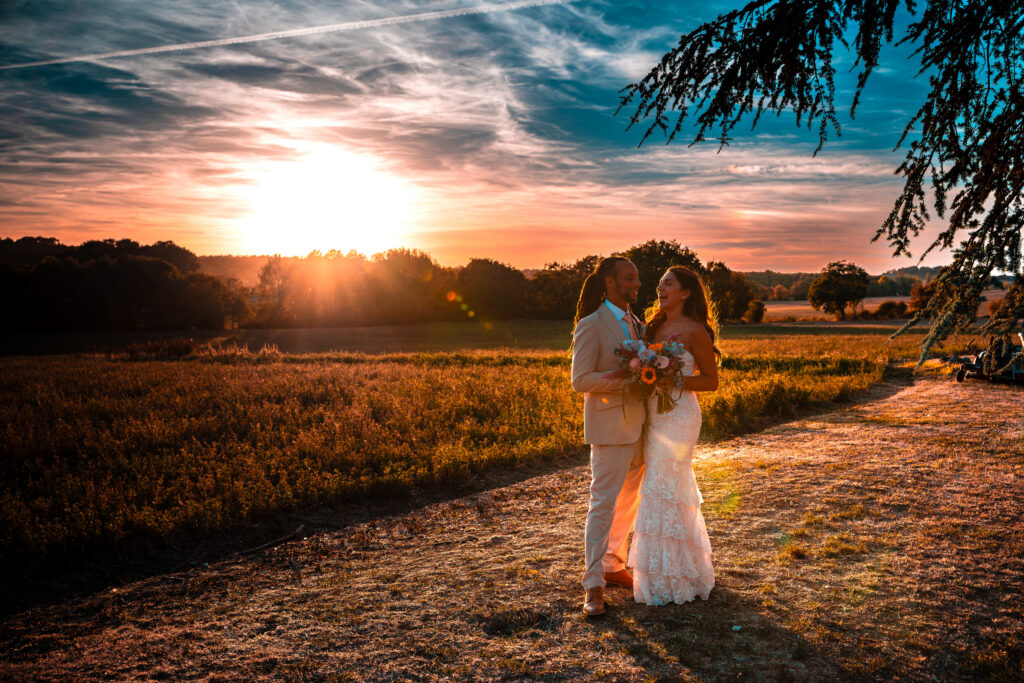 Couple in Dordogne, France at their multi-day wedding at sunset.